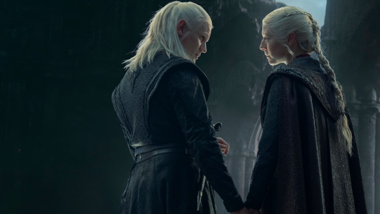 Daemon (Matt Smith) and Rhaenyra (Emma D'Arcy) hold hands in House of the Dragon season 2 episode 8.